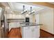 Modern kitchen with a center island, granite countertops and stainless steel appliances at 6969 W Yale Ave # 81, Denver, CO 80227