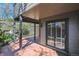 Covered patio featuring dark support beams and a sliding glass door at 6969 W Yale Ave # 81, Denver, CO 80227