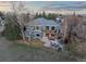 Aerial view of the house, backyard with patio and fire pit, and a beautiful tree-filled neighborhood at 4825 6Th St, Boulder, CO 80304
