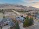 Stunning aerial view of a well-maintained home with mountain views and solar panels on a quiet street at 4825 6Th St, Boulder, CO 80304