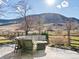 Inviting back patio features comfortable seating and a fire pit with scenic views of the surrounding mountain landscape at 4825 6Th St, Boulder, CO 80304