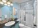 Modern bathroom featuring a glass-enclosed shower and stylish vanity with ample counter space at 4825 6Th St, Boulder, CO 80304