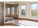 Tiled bathroom with separate tub and shower enclosure at 4825 6Th St, Boulder, CO 80304