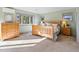 Bedroom featuring light green walls, carpet floors, and natural light through large windows at 4825 6Th St, Boulder, CO 80304