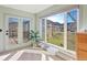 Bright bedroom featuring large window with outdoor view and door leading to an outdoor deck at 4825 6Th St, Boulder, CO 80304