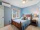 Cozy bedroom with a wood frame bed, natural light from bay window, and a side table at 4825 6Th St, Boulder, CO 80304