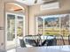 Bright breakfast nook with large windows showcasing mountain views, and a glass table perfect for morning meals at 4825 6Th St, Boulder, CO 80304