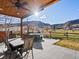 Inviting covered patio with ceiling fan, perfect for outdoor dining and relaxation with mountain views at 4825 6Th St, Boulder, CO 80304