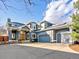 Inviting blue two-story home with a three car garage and large concrete driveway at 4825 6Th St, Boulder, CO 80304