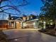 Stunning exterior view of home with a large driveway and attached garage, beautifully illuminated at twilight at 4825 6Th St, Boulder, CO 80304