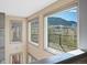 Hallway with windows showcasing the mountains and outdoor deck at 4825 6Th St, Boulder, CO 80304