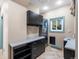 Convenient laundry room featuring modern washer and dryer, counter space, and storage cabinets at 4825 6Th St, Boulder, CO 80304