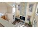 Aerial view of bright living room with fireplace, tall windows, and open floor plan at 4825 6Th St, Boulder, CO 80304