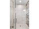 Contemporary bathroom featuring a glass-enclosed shower with sleek tiling and a rainfall showerhead at 1215 N Perry St, Denver, CO 80204