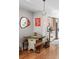 Charming dining area with a rustic table, bench seating, and hardwood floors at 1215 N Perry St, Denver, CO 80204