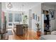 Bright kitchen featuring a center island with bar stools and modern pendant lighting at 1215 N Perry St, Denver, CO 80204