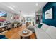 Open-concept living room with hardwood floors, modern decor, and plenty of natural light at 1215 N Perry St, Denver, CO 80204