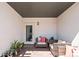 Charming patio with comfortable wicker seating and inviting plants, perfect for relaxing outdoors at 1215 N Perry St, Denver, CO 80204
