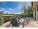 Backyard patio featuring mature landscaping, a fire pit, and golf course views at 234 Cypress Cir, Broomfield, CO 80020