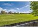 Expansive backyard showcasing lush green grass and mature trees, perfect for outdoor activities at 234 Cypress Cir, Broomfield, CO 80020