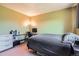 Comfortable bedroom features a desk with computer setup and soft green walls at 234 Cypress Cir, Broomfield, CO 80020