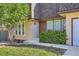 This cozy home has a well-maintained front yard, and a brown front door, with several windows at 234 Cypress Cir, Broomfield, CO 80020