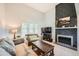 Spacious living room with a cozy fireplace, high ceilings, and lots of natural light at 234 Cypress Cir, Broomfield, CO 80020