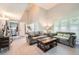The open living room has a vaulted ceiling, a staircase, neutral walls, and hardwood flooring at 234 Cypress Cir, Broomfield, CO 80020