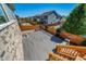 Spacious back deck with gray floors and wood railing, perfect for outdoor relaxation and entertaining at 17028 Osage St, Broomfield, CO 80023