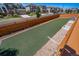 AstroTurf backyard bordered by rocks and a wood fence, creating a low-maintenance and inviting outdoor space at 17028 Osage St, Broomfield, CO 80023