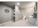 A modern bathroom with a glass-enclosed shower, vanity, shelving, and stylish fixtures at 17028 Osage St, Broomfield, CO 80023