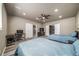 A bedroom with two beds, a closet with sliding doors, a desk, and access to other areas of the home at 17028 Osage St, Broomfield, CO 80023