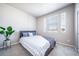 Bedroom featuring carpet floors and a large window at 17028 Osage St, Broomfield, CO 80023