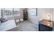 Cozy bedroom featuring a daybed, a desk, and plush decor for a comfortable and stylish space at 17028 Osage St, Broomfield, CO 80023