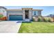 Charming home with a well-maintained lawn, complemented by a stone entryway and a two-car garage at 17028 Osage St, Broomfield, CO 80023