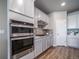 Close-up of the gourmet kitchen featuring stainless steel appliances and a sleek cooktop at 17028 Osage St, Broomfield, CO 80023