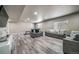 Large living room featuring gray floors and furniture at 17028 Osage St, Broomfield, CO 80023