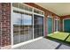 Balcony showcasing a sliding glass door, offering ample natural light and outdoor access at 9481 E Mansfield Ave # 203, Aurora, CO 80014