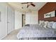 Spacious bedroom with carpet, ceiling fan and access to a bathroom, closet and hallway at 9481 E Mansfield Ave # 203, Aurora, CO 80014