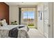 Bright bedroom features a sliding glass door with balcony access and great natural light at 9481 E Mansfield Ave # 203, Aurora, CO 80014