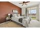 Inviting bedroom with a sliding glass door to a balcony, enhanced by a ceiling fan at 9481 E Mansfield Ave # 203, Aurora, CO 80014