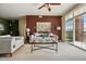 Spacious living room featuring stylish decor, a cozy sofa, and natural light from the sliding doors at 9481 E Mansfield Ave # 203, Aurora, CO 80014