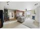 Inviting living space with open layout, modern kitchen, fireplace, and access to a private balcony at 9481 E Mansfield Ave # 203, Aurora, CO 80014