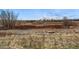 Expansive natural landscape with dry vegetation stretching to the horizon at 9481 E Mansfield Ave # 203, Aurora, CO 80014