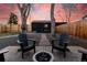 Cozy backyard seating with Adirondack chairs arranged around a fire pit for relaxation at 4565 Elm Ct, Denver, CO 80211