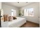 Cozy bedroom with hardwood floors, lots of light from the windows, and simple yet stylish decor at 4565 Elm Ct, Denver, CO 80211