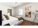 Bright bedroom with hardwood floors, white walls and minimalist style at 4565 Elm Ct, Denver, CO 80211