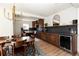 Spacious kitchen and dining area with hardwood floors, stainless steel appliances, and wine fridge at 4565 Elm Ct, Denver, CO 80211