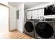 The laundry room features a new washer and dryer at 4565 Elm Ct, Denver, CO 80211