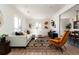 Bright and airy living room with a large rug, comfortable seating and white walls at 4565 Elm Ct, Denver, CO 80211